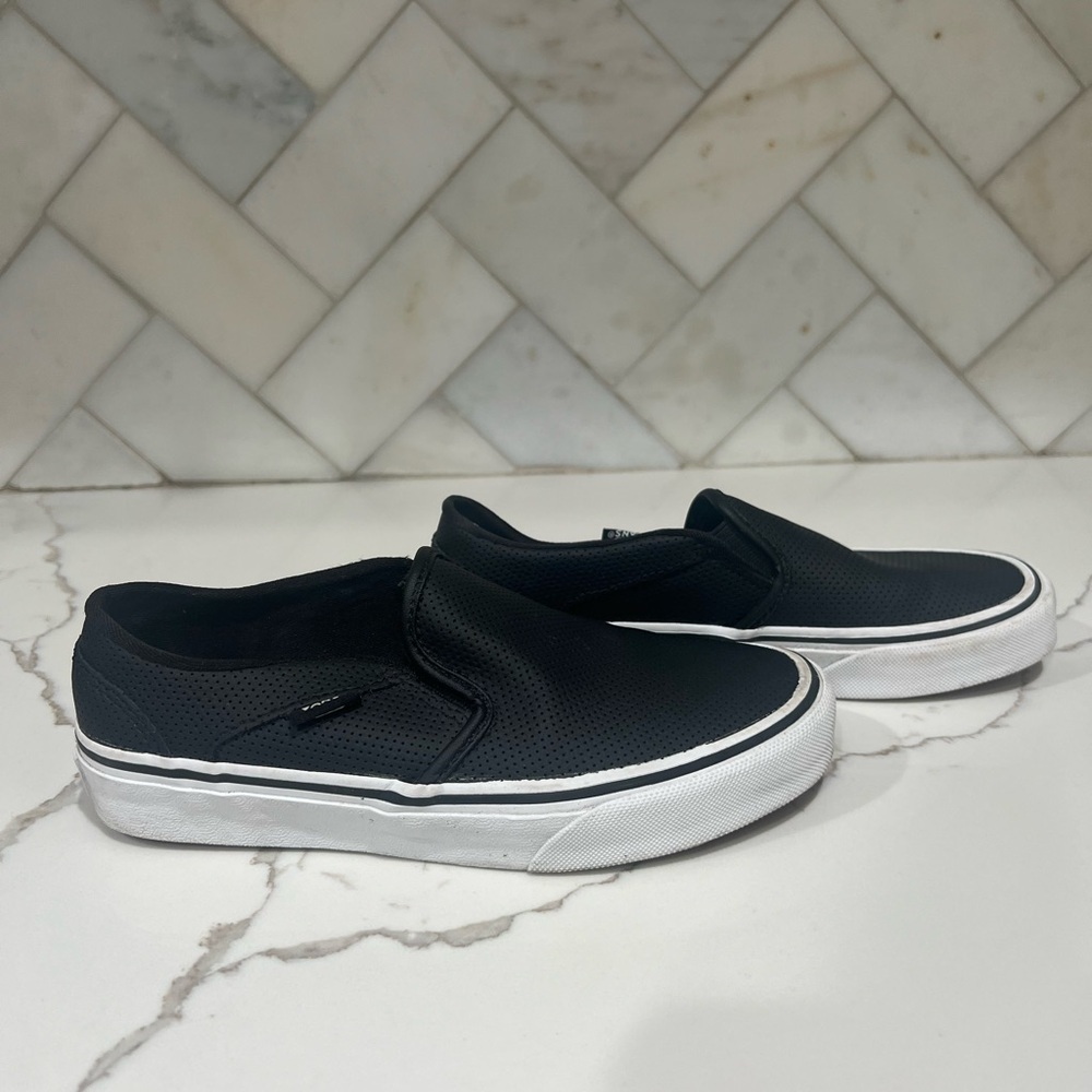 Black and white Vans slip-on trainers